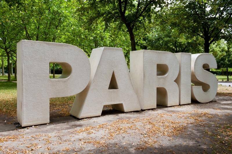 Cartel de París en la entrada del Parc Floral